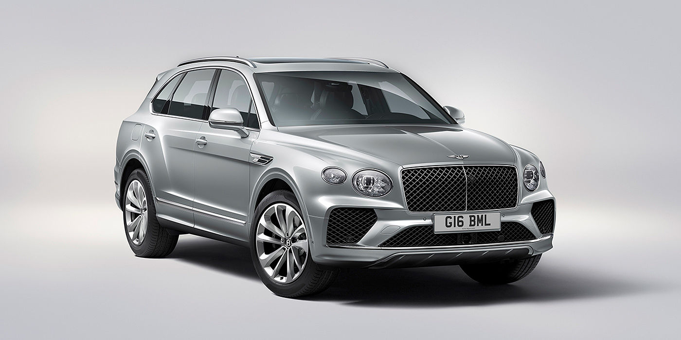 Bentley Emirates -  Abu Dhabi Bentley Bentayga in Moonbeam paint, front three-quarter view, featuring a matrix grille and elliptical LED headlights.