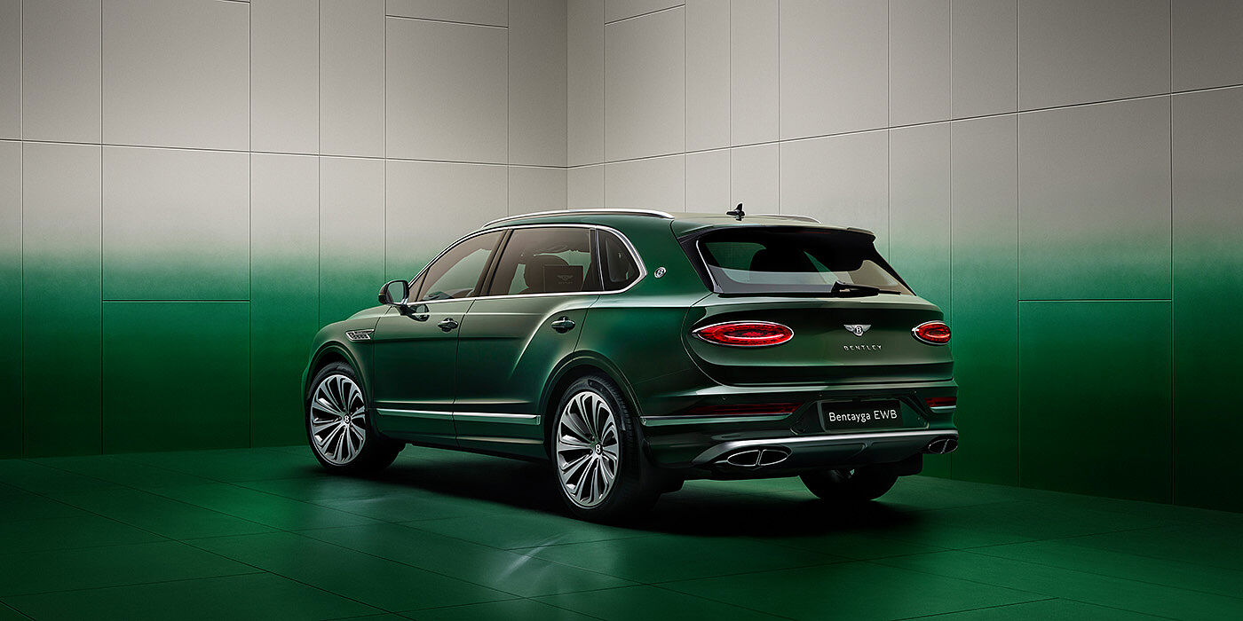 Bentley Abu Dhabi Bentley Bentayga Extended Wheelbase SUV Rear three quarter view in Light Emerald green paint in green and grey room