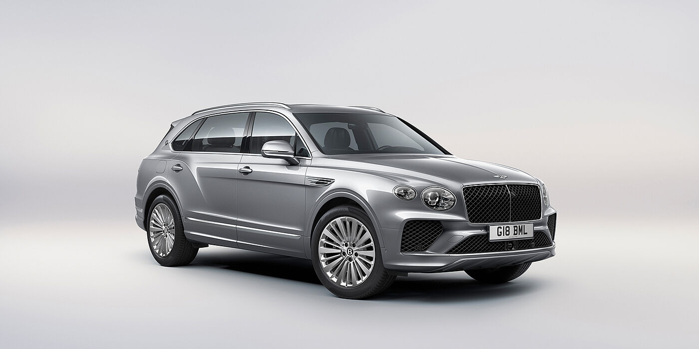 Bentley Abu Dhabi Bentley Bentayga Extended Wheelbase luxury SUV front three quarter view in Moonbeam paint with 21 inch five spoke painted wheels