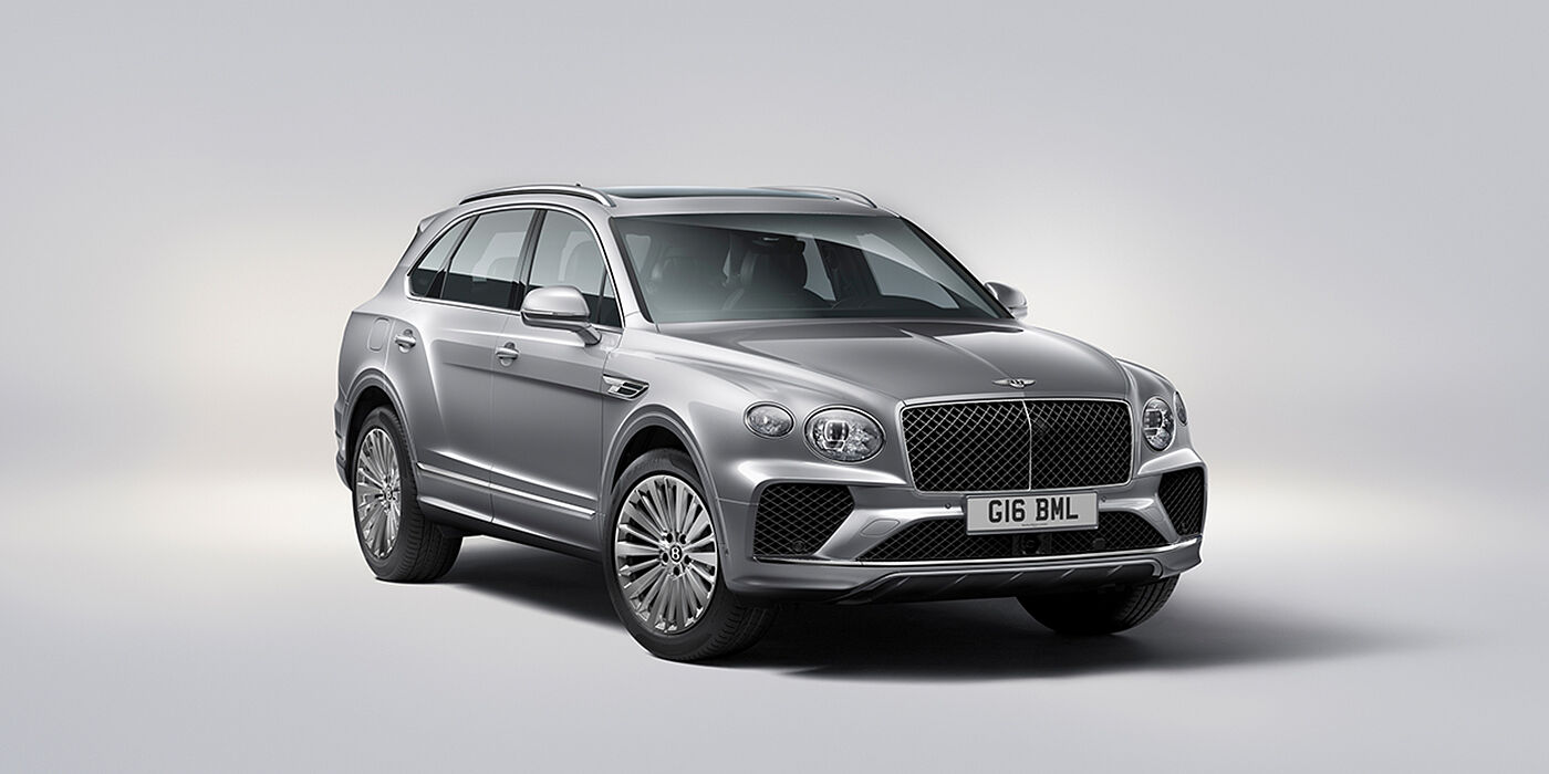 Bentley Abu Dhabi Bentley Bentayga luxury SUV front three quarter view in Moonbeam paint with matrix grille and 21″ 5 spoke painted wheels