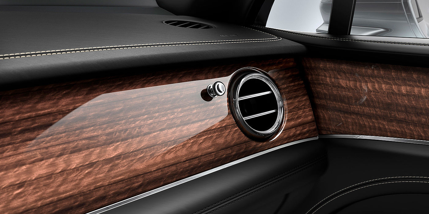 Bentley Emirates -  Abu Dhabi Bentley Bentayga front interior Crown Cut Walnut veneer and chrome air vent.