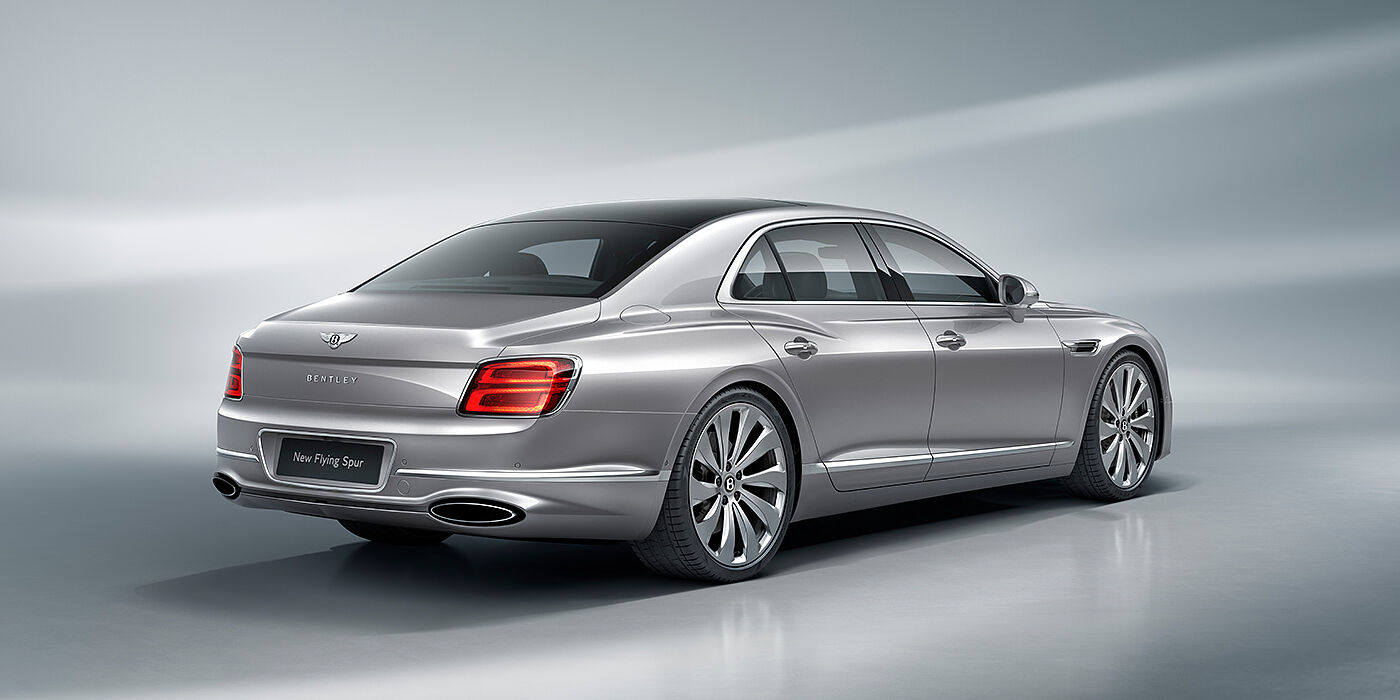 Bentley Abu Dhabi New Bentley Flying Spur sedan rear view in Silverlake paint with ten spoke wheels and chrome matrix grille