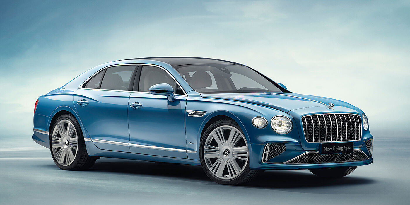Bentley Abu Dhabi New Bentley Flying Spur Azure sedan front view in Light windsor blue by Mulliner paint with 22 inch Azure wheels and chrome exterior details