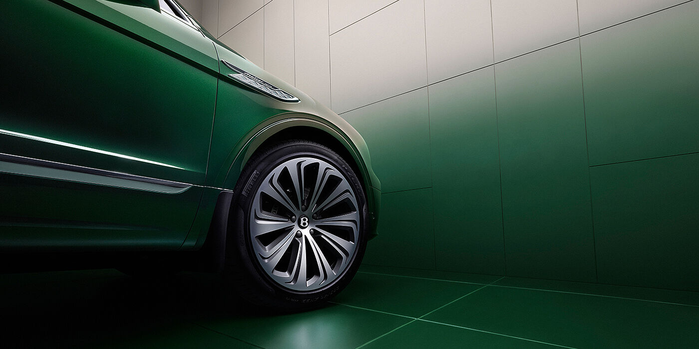 Bentley Abu Dhabi Bentley Bentayga Extended Wheelbase Atelier Edition SUV in Light Emerald green paint front side detail with 22 inch 10 spoke wheel