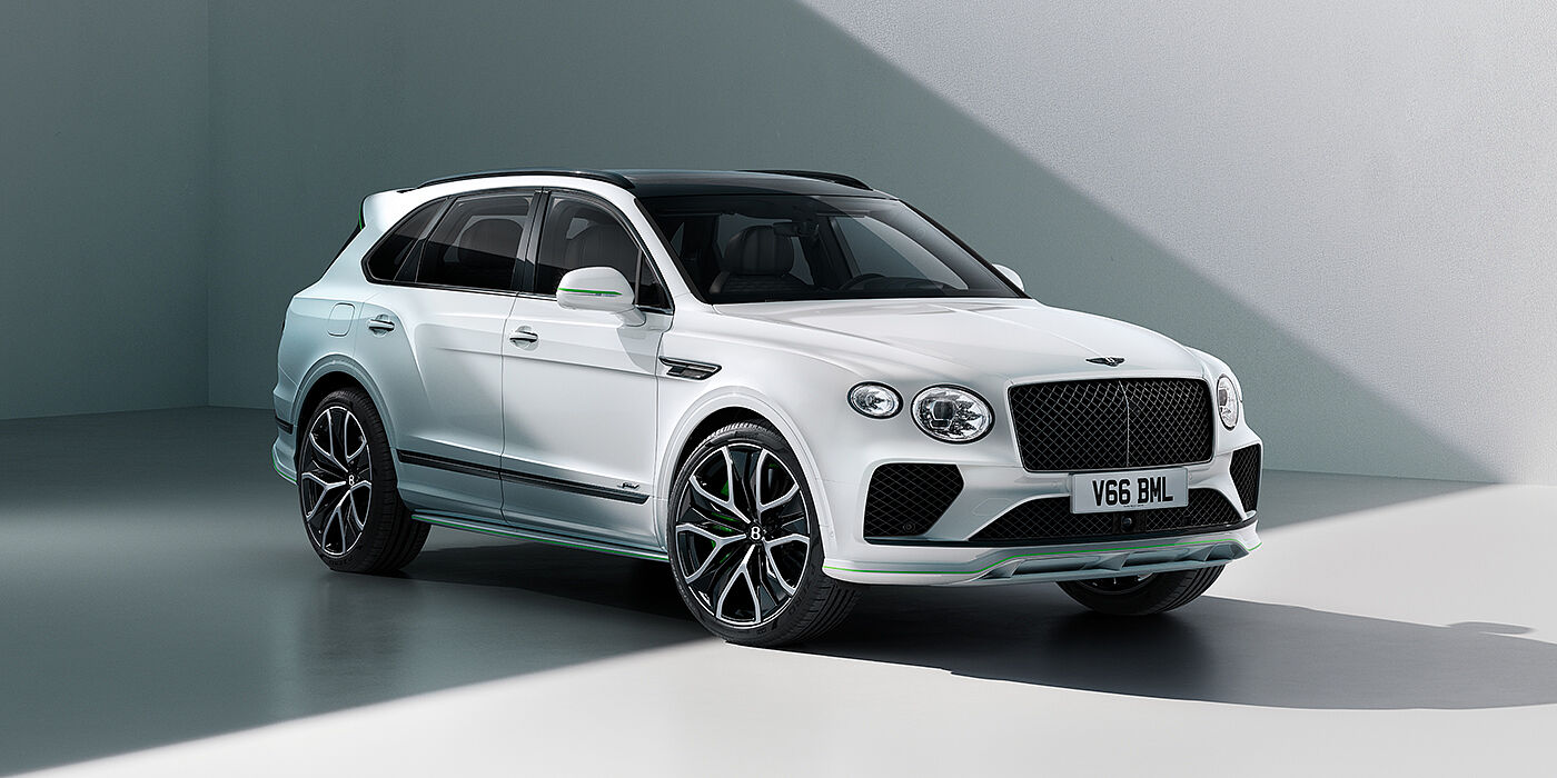 Bentley Abu Dhabi Bentley Bentayga Speed SUV front three quarter in Snow Quartz Pearlescent by Mulliner white paint against a grey wall