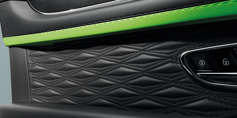 Bentley Abu Dhabi Bentley Bentayga Speed SUV interior door detail with Diamond in Diamond stitched hide in Beluga black colour, with Black stained Crown Cut Walnut veneer