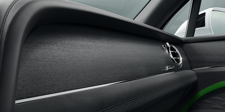 Bentley Abu Dhabi Bentley Bentayga Speed SUV front dash close up in Hyper Green and Beluga black hides, with Black Stained Crown Cut Walnut veneer