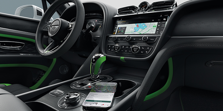 Bentley Abu Dhabi Bentley Bentayga Speed SUV front cabin in Hyper Green and Beluga black hides, with Black Stained Crown Cut Walnut veneer